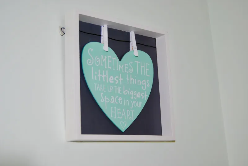 A heart-shaped sign reading Sometimes the littlest things take up the biggest space in your heart